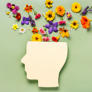 Vetor de cabeça com flores saindo, representando um cérebro saudável